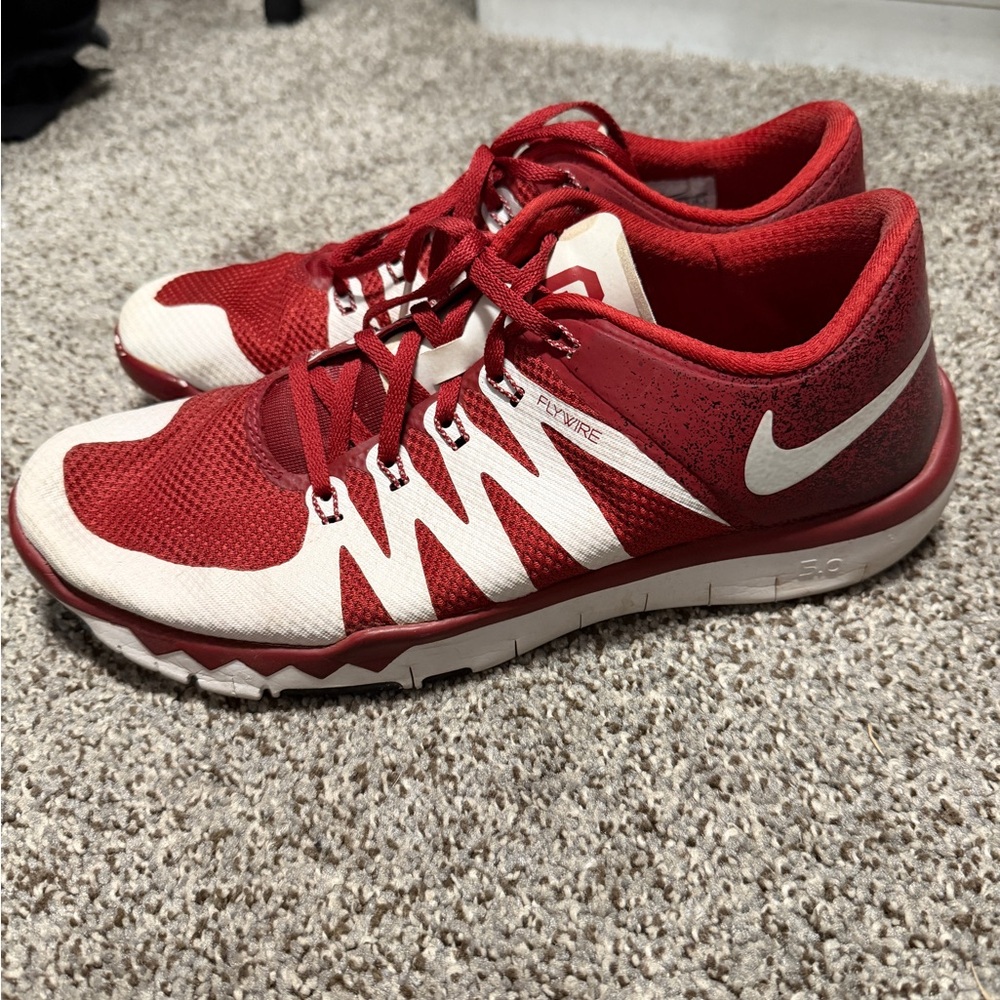 Red and white (crimson and cream) Oklahoma Sooners Nike shoes